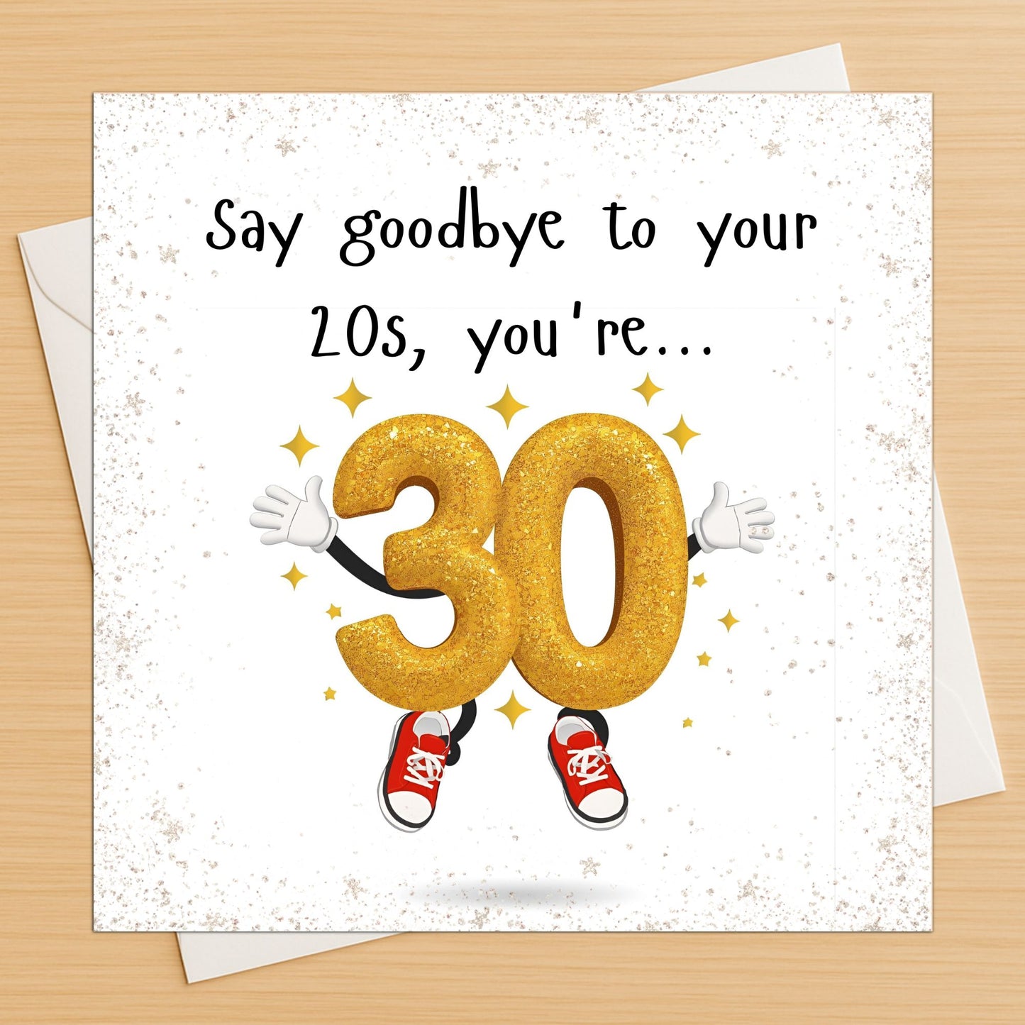 30th birthday card with a gold number 30 character on an envelope on a wooden table