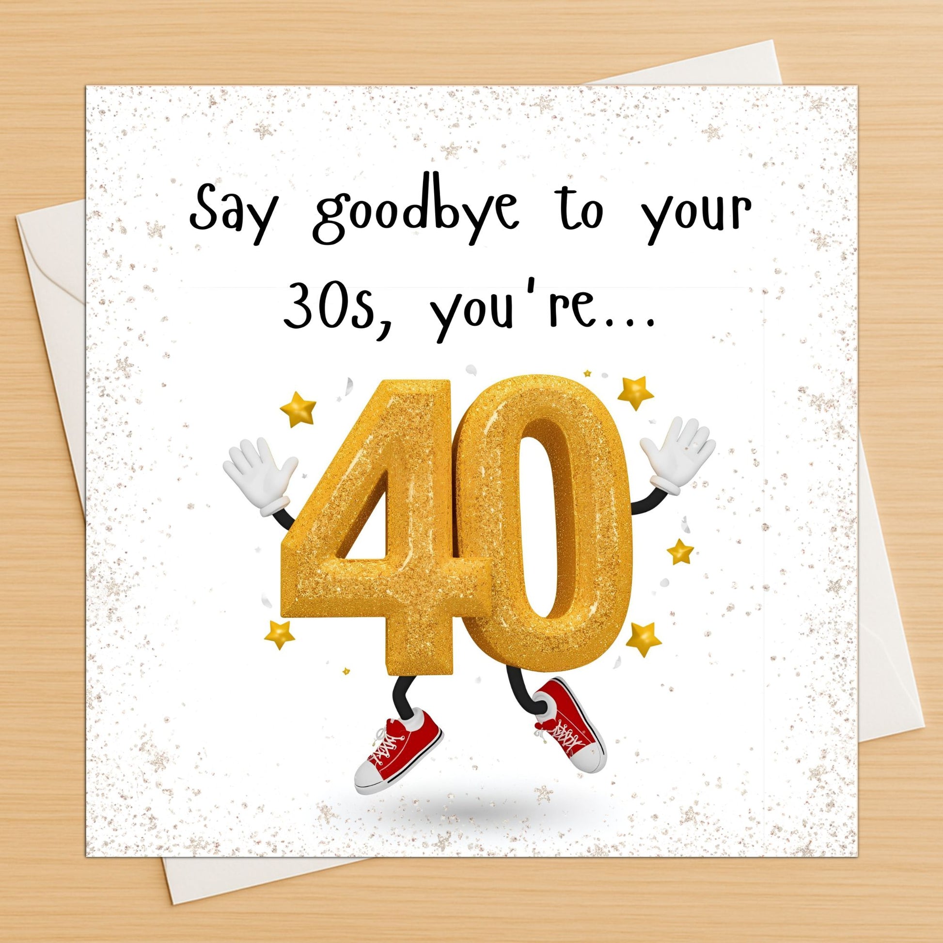 40th birthday card with a gold number 40 character on an envelope on a wooden table