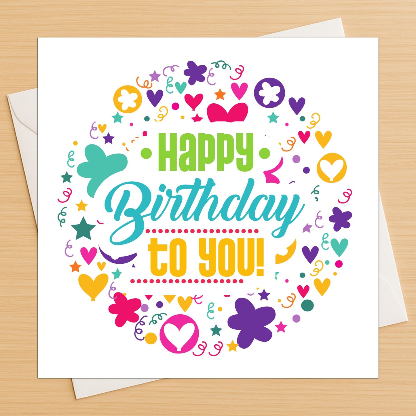 Circle design happy birthday card with colourful confetti and shapes on wooden table