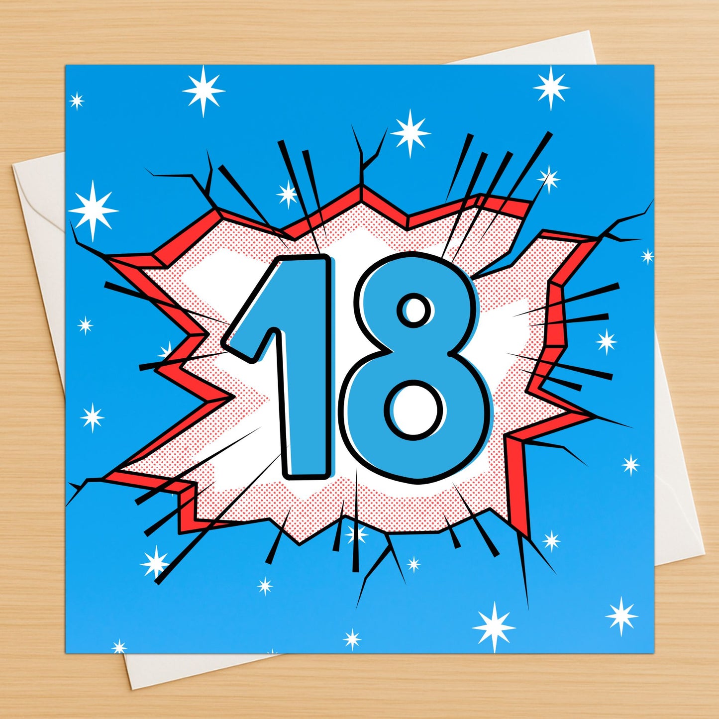 Comic book style birthday card with number 18 on a blue background with stars, on a wooden surface.