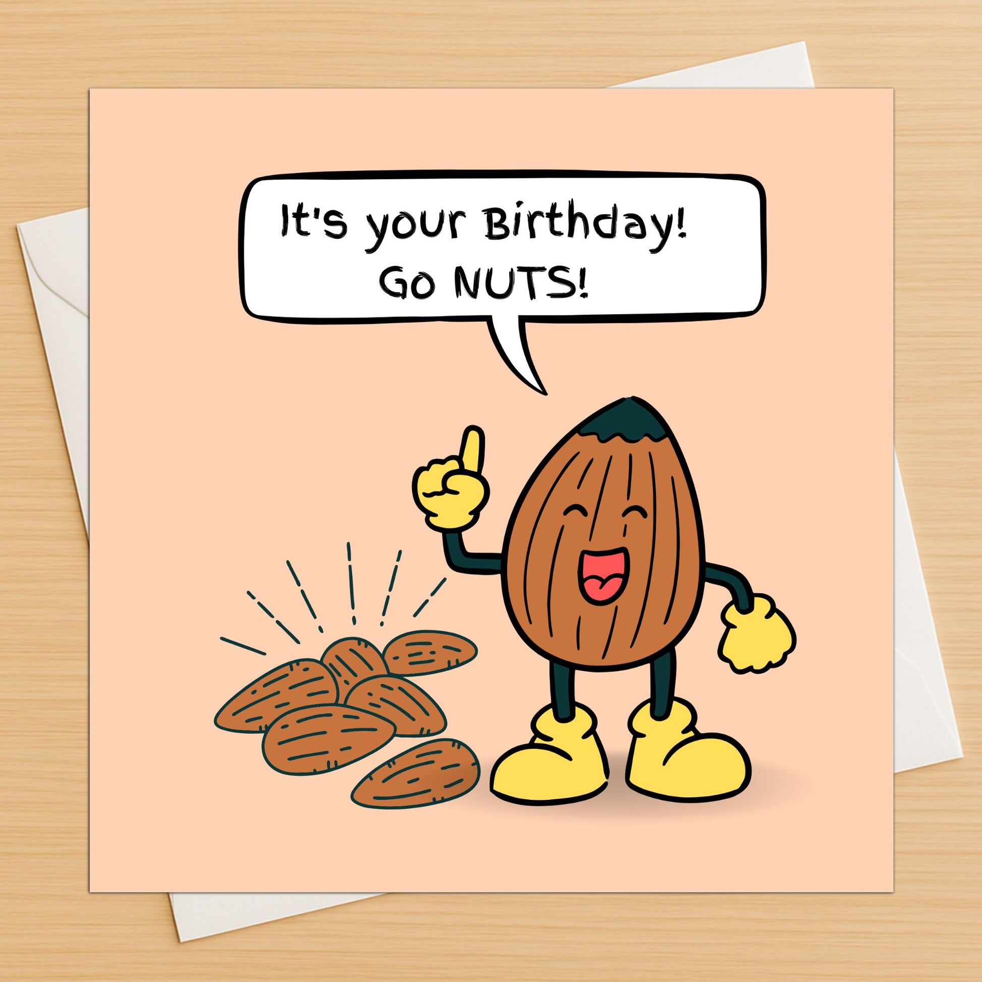 Birthday card with cartoon nut character and text 'It's your Birthday! Go NUTS!' on a beige background.