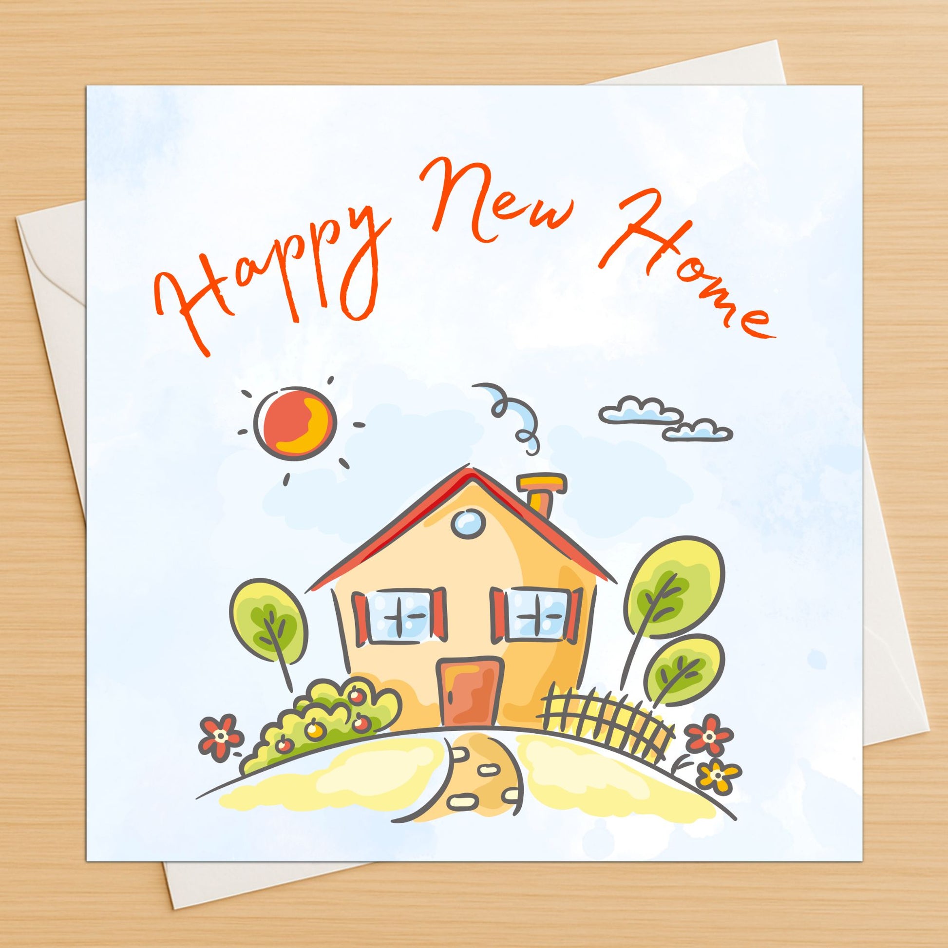 Greeting card with a house illustration and 'Happy New Home' text on a white envelope on a wooden surface