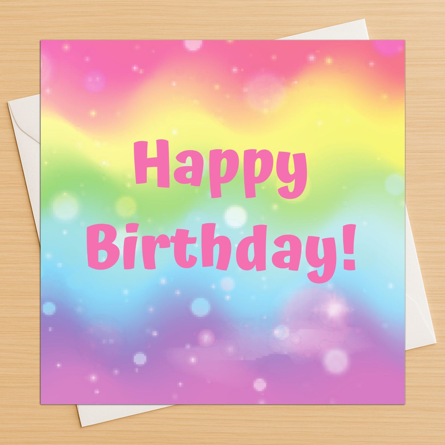 Rainbow sparkle happy birthday card with colourful pastel design on wooden table